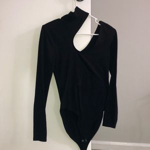 Black bodysuit with high neck and shoulder cut out